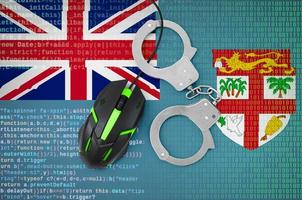 Fiji flag and handcuffed computer mouse. Combating computer crime, hackers and piracy photo