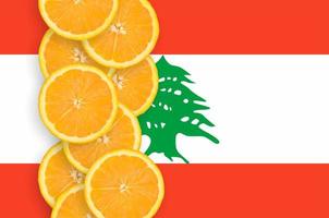 Lebanon flag and citrus fruit slices vertical row photo