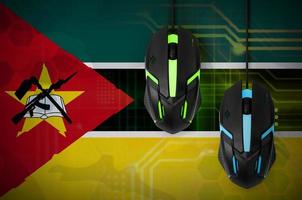Mozambique flag and two mice with backlight. Online cooperative games. Cyber sport team photo