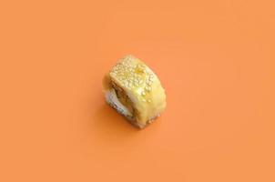 Tori Katsu sushi Roll Maki with processed cheese on orange background. Minimalism top view flat lay with Japanese food photo