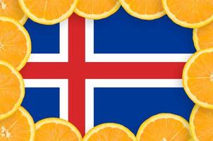 Iceland flag in fresh citrus fruit slices frame photo