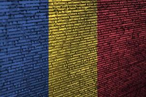 Romania flag is depicted on the screen with the program code. The concept of modern technology and site development photo