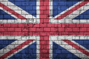 Great britain flag is painted onto an old brick wall photo