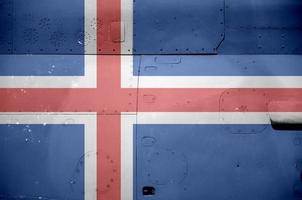Iceland flag depicted on side part of military armored helicopter closeup. Army forces aircraft conceptual background photo