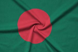 Bangladesh flag is depicted on a sports cloth fabric with many folds. Sport team banner photo