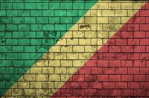 Congo flag is painted onto an old brick wall photo