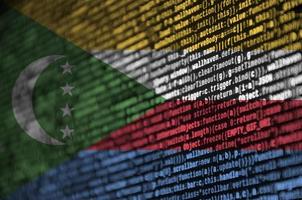 Comoros flag is depicted on the screen with the program code. The concept of modern technology and site development photo