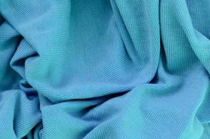 The texture of the fabric in blue color. Material for making shirts and blouses photo