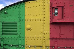 Mali flag depicted on side part of military armored tank closeup. Army forces conceptual background photo