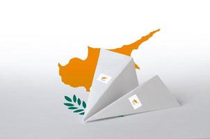 Cyprus flag depicted on paper origami airplane. Handmade arts concept photo