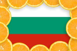 Bulgaria flag in fresh citrus fruit slices frame photo