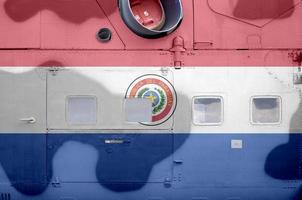 Paraguay flag depicted on side part of military armored helicopter closeup. Army forces aircraft conceptual background photo