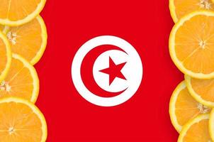 Tunisia flag in citrus fruit slices vertical frame photo