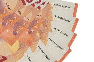 10 euro bills lies isolated on white background with copy space stacked in fan shape close up photo