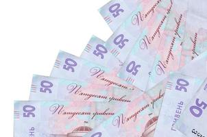 50 Ukrainian hryvnias bills lies in different order isolated on white. Local banking or money making concept photo