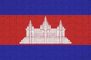 Cambodia flag is depicted on a folded puzzle photo