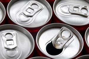 Many aluminium soda drink cans. Advertising for Soda drinks or tin cans mass manufacturing photo