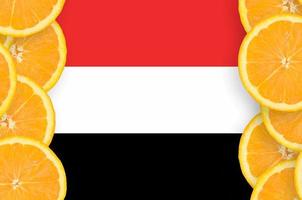 Yemen flag in citrus fruit slices vertical frame photo