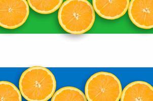 Sierra Leone flag in citrus fruit slices horizontal frame photo