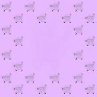 Shopping addiction, shopping lover or shopaholic concept. Many small empty shopping carts perform a pattern on a pastel colored paper background. Flat lay composition, top view photo