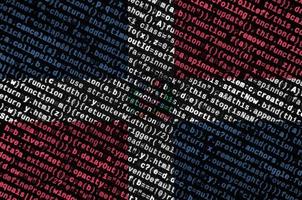 Dominican Republic flag is depicted on the screen with the program code. The concept of modern technology and site development photo