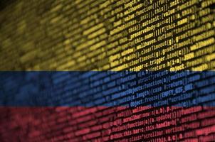 Colombia flag is depicted on the screen with the program code. The concept of modern technology and site development photo