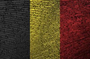 Belgium flag is depicted on the screen with the program code. The concept of modern technology and site development photo