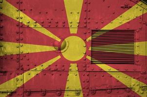 Macedonia flag depicted on side part of military armored tank closeup. Army forces conceptual background photo