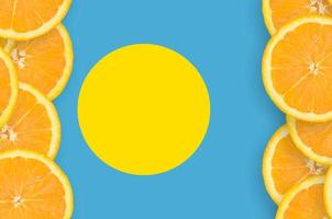 Palau flag in citrus fruit slices vertical frame photo