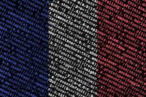 France flag is depicted on the screen with the program code. The concept of modern technology and site development photo