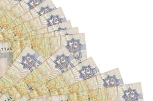 25 Egyptian piastres bills lies isolated on white background with copy space stacked in fan close up photo