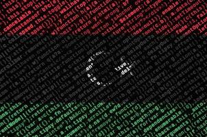 Libya flag is depicted on the screen with the program code. The concept of modern technology and site development photo