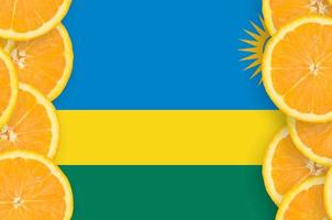 Rwanda flag in citrus fruit slices vertical frame photo