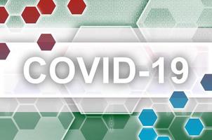 Suriname flag and futuristic digital abstract composition with Covid-19 inscription. Coronavirus outbreak concept photo