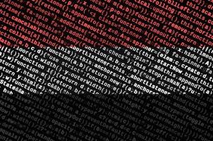 Yemen flag is depicted on the screen with the program code. The concept of modern technology and site development photo