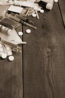 A lot of narcotic substances and devices for the preparation of drugs lie on an old wooden table photo
