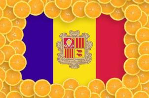 Andorra flag in fresh citrus fruit slices frame photo