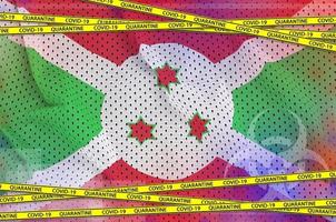 Burundi flag and Covid-19 quarantine yellow tape. Coronavirus or 2019-nCov virus concept photo