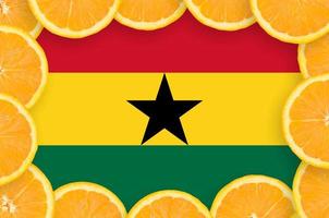 Ghana flag in fresh citrus fruit slices frame photo