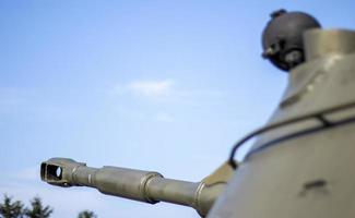 Tower of an armored personnel carrier or tank. Heavy weapons of war, sky background. Army equipment for combat and defense. Cannon tower. Details of military equipment. Close-up. photo