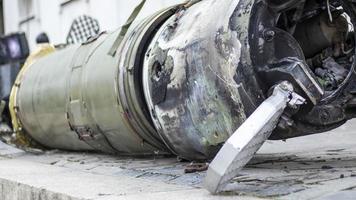 Remains of missile units of the operational-tactical missile system Tochka-U, 9M79M. The air defense system shot down a missile, part of it fell near the house. Soviet tactical bomb on the street. photo