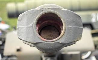 Tank gun or barrel. Muzzle or flash hider close-up. photo