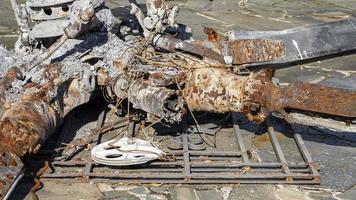 Detail of the Mi-24 helicopter. Remains of a destroyed Russian Air Force combat helicopter Hind Crocodile. Engine rotor, blades, tail, wreckage of a crashed military attack helicopter close-up. photo