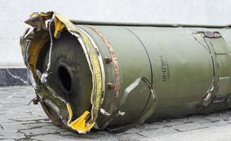 Parts of a tactical ballistic missile, OTR-21. Destroyed Russian military equipment. Spent projectile of the Soviet missile system of the divisional level Tochka U, SS-21 Scarab A, M-21. photo