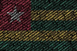 Togo flag is depicted on the screen with the program code. The concept of modern technology and site development photo
