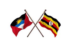 antigua y barbuda contra uganda dos banderas de países foto