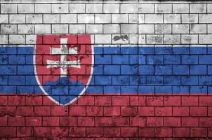 Slovakia flag is painted onto an old brick wall photo