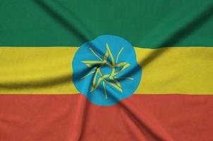 Ethiopia flag is depicted on a sports cloth fabric with many folds. Sport team banner photo