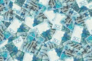 500 Kazakhstani tenge bills lies in big pile. Rich life conceptual background photo