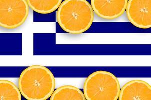 Greece flag in citrus fruit slices horizontal frame photo